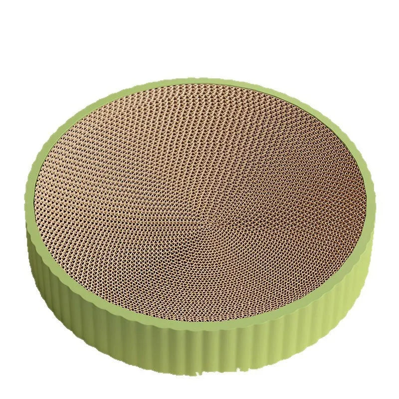 Round green cat scratching board with corrugated cardboard centre measuring 55cm diameter