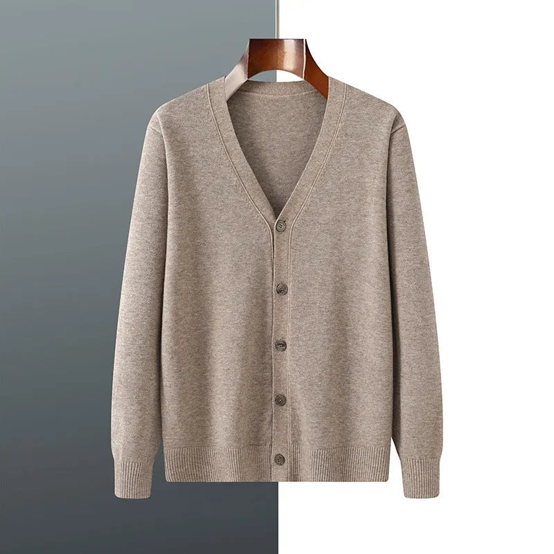 Man wearing a loose V-neck cardigan coat in Andy Velvet fabric, showing the long sleeves and available colour options.