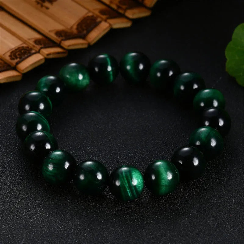 Natural green tiger eye stone bracelet with geometric polished beads in various sizes