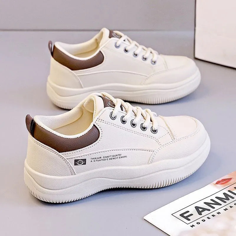 Women's white Korean-style lace-up pumps with cross straps and a flat rubber sole.