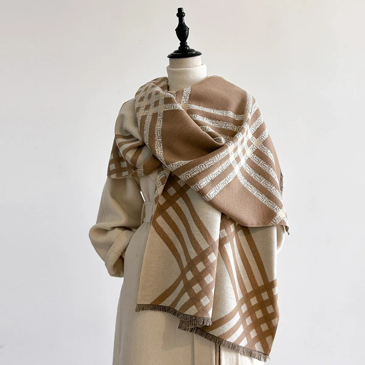 Cashmere-like scarf with tassel detailing in brown colour showing mid-length design