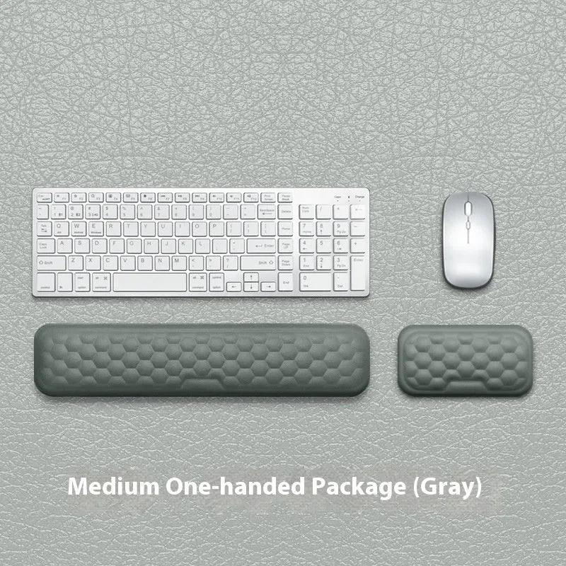 Memory foam mouse wrist rest pad with silicone base in black cloth cover option on desk