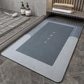 Blended fabric bathroom floor mat in oval and rectangular shapes on a tiled floor.