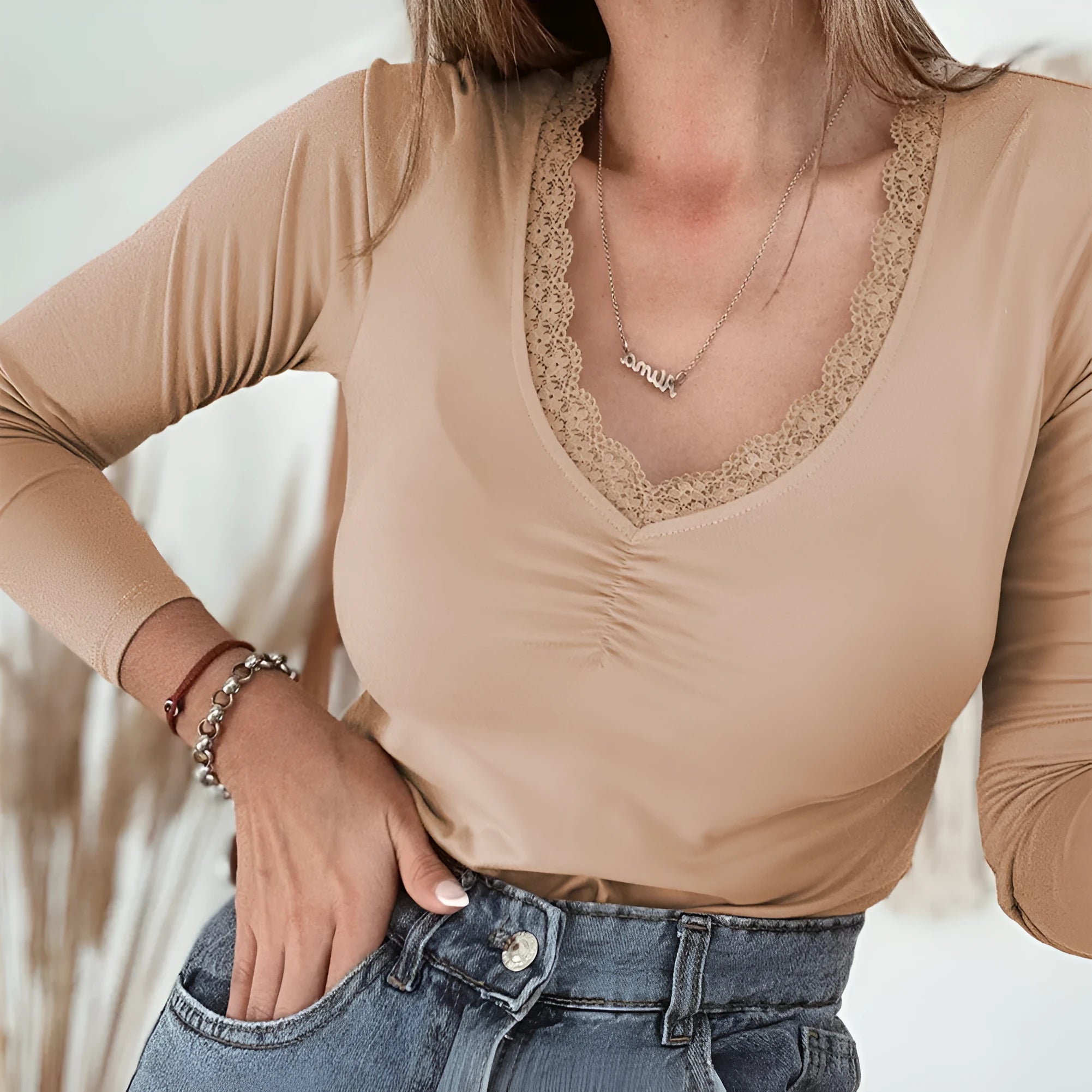 Red women's slim fit long sleeve casual top with lace trim detail on the sleeves.