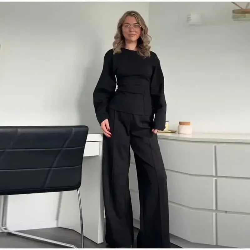 Women's polar fleece two-piece suit set showing long sleeve O-neck top with wide-leg trousers