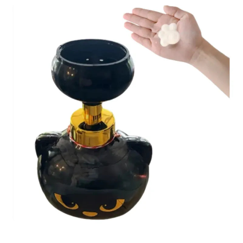 Black plastic cartoon cat-shaped foam soap extrusion dispenser on a bathroom countertop.