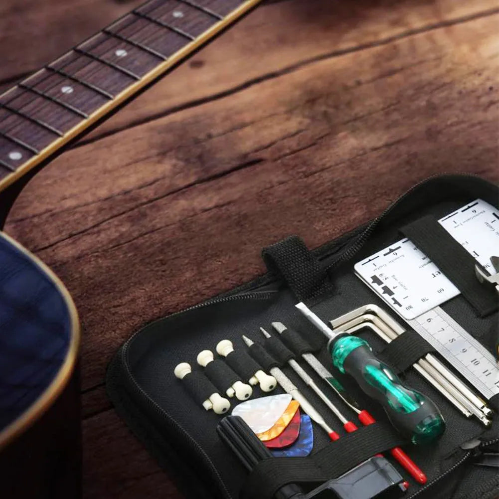 Black plastic guitar repair tool kit case with metal maintenance tools for string instruments
