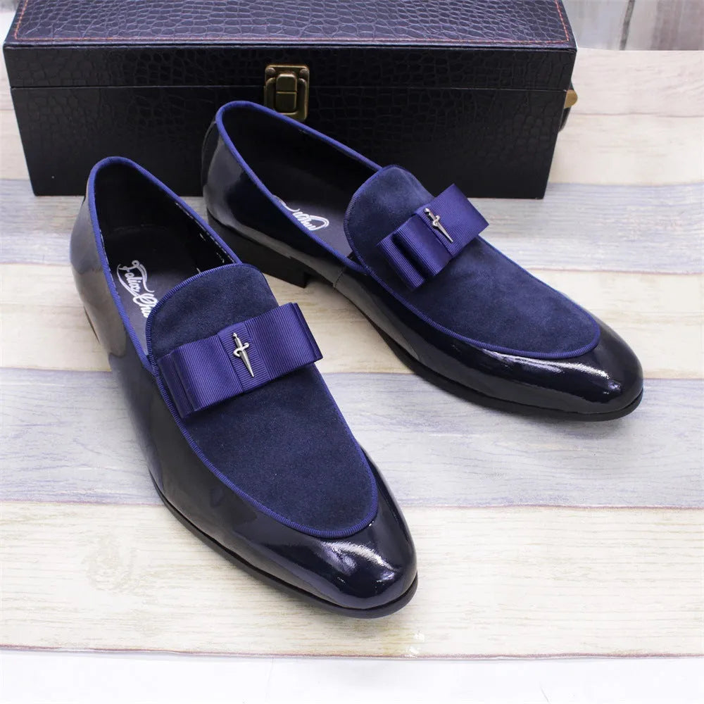 Men's black patent leather low-top dress shoes with a tassel detail on the front.