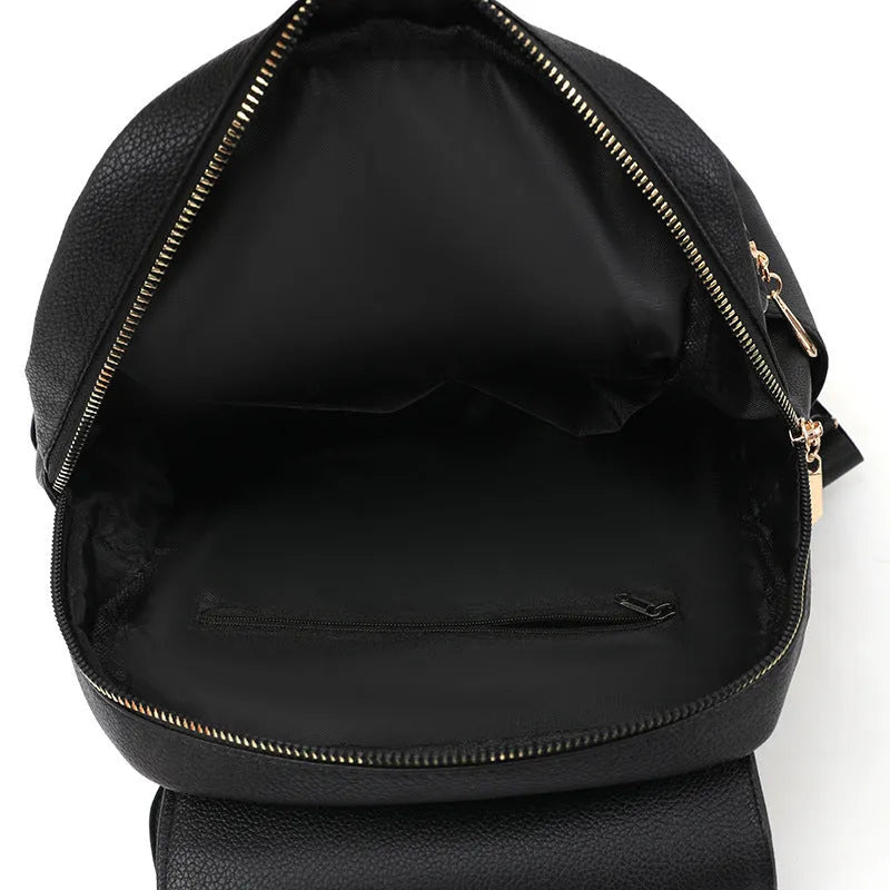 Women's textured leather backpack in black with three-dimensional pockets and street style design