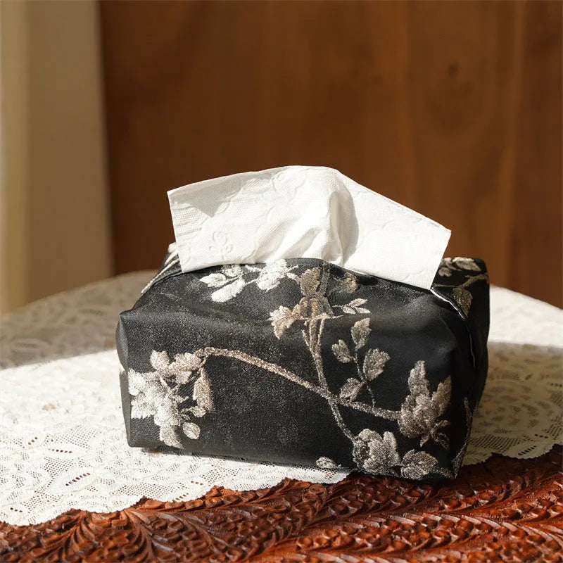White Chinese brocade tissue box cover with embroidered plum design and optional pearl buckle.