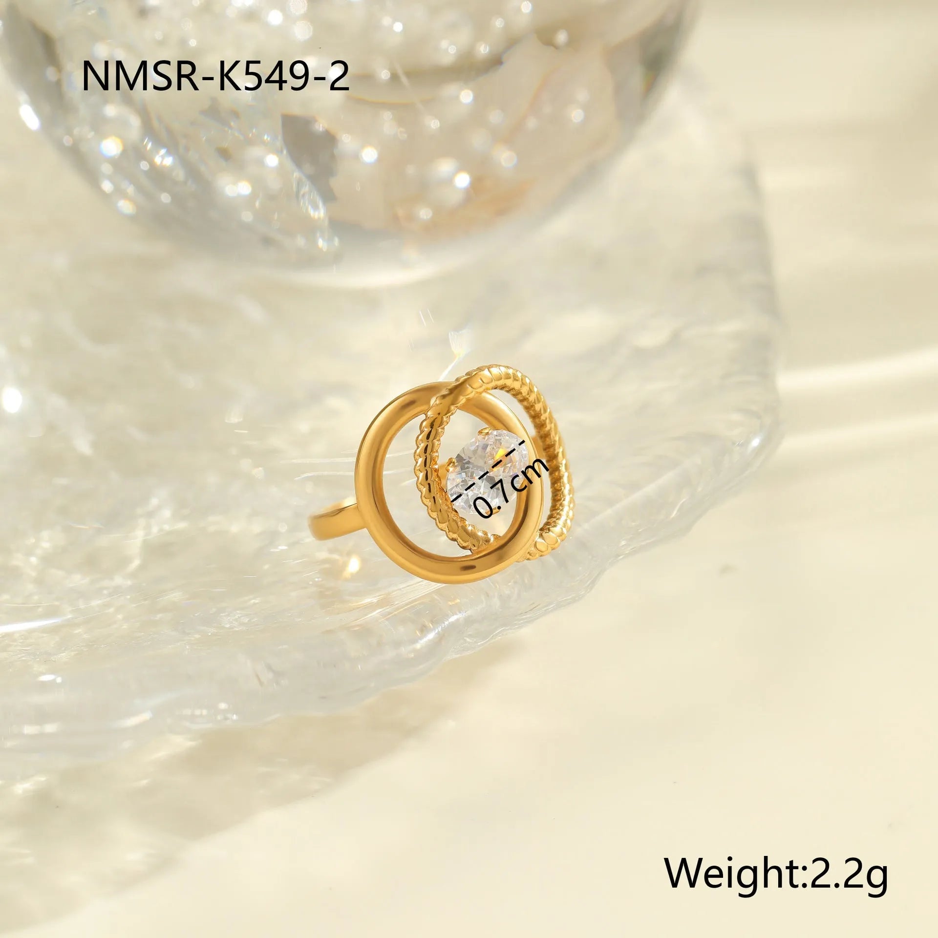 Gold-plated geometric stainless steel ring with inlaid zircon stones on a white background.