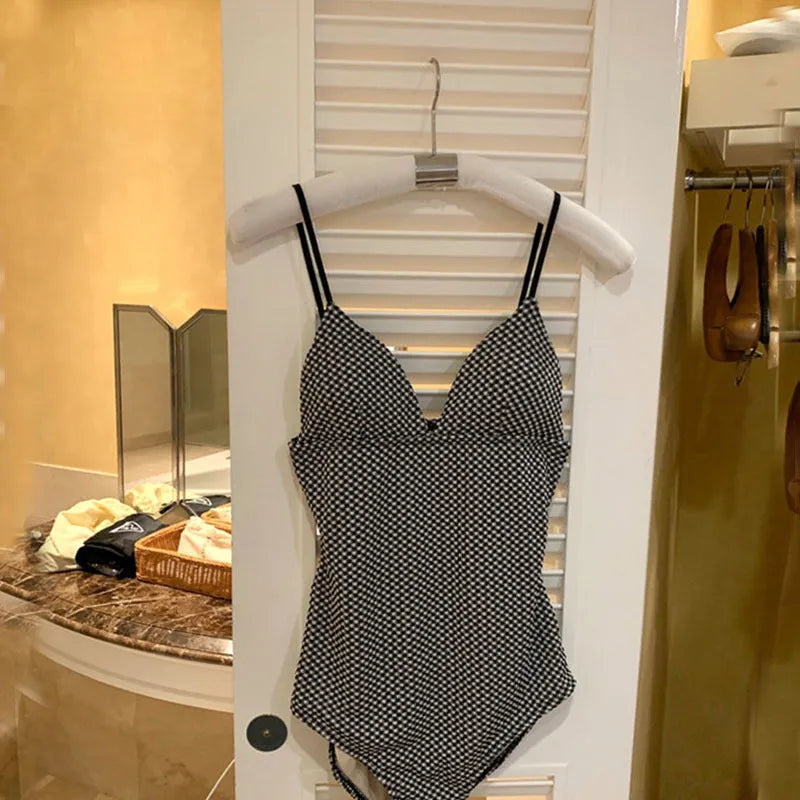 Blue women's one-piece swimsuit with belly cover, designed for smaller chests.
