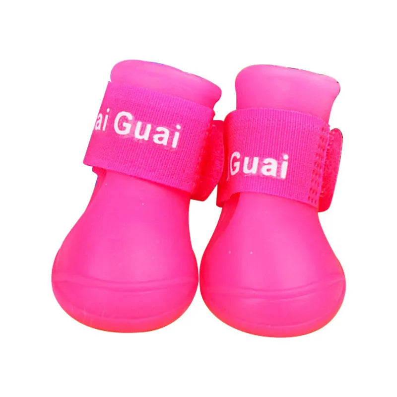Soft silicone pet rain boots in royal blue and yellow, showing non-slip sole, for dogs size S M L