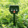 Green solar-powered ultrasonic animal repeller with motion sensor for outdoor pest control
