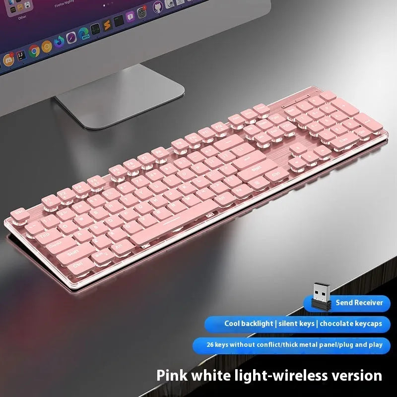 Wireless mute Bluetooth keyboard with ice blue backlighting on desk