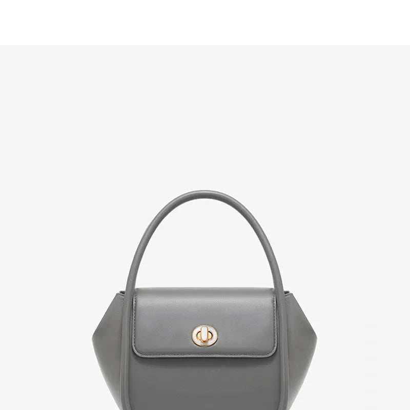 Leather wing bag with latch closure and buckle detailing in cow leather with cross-body strap