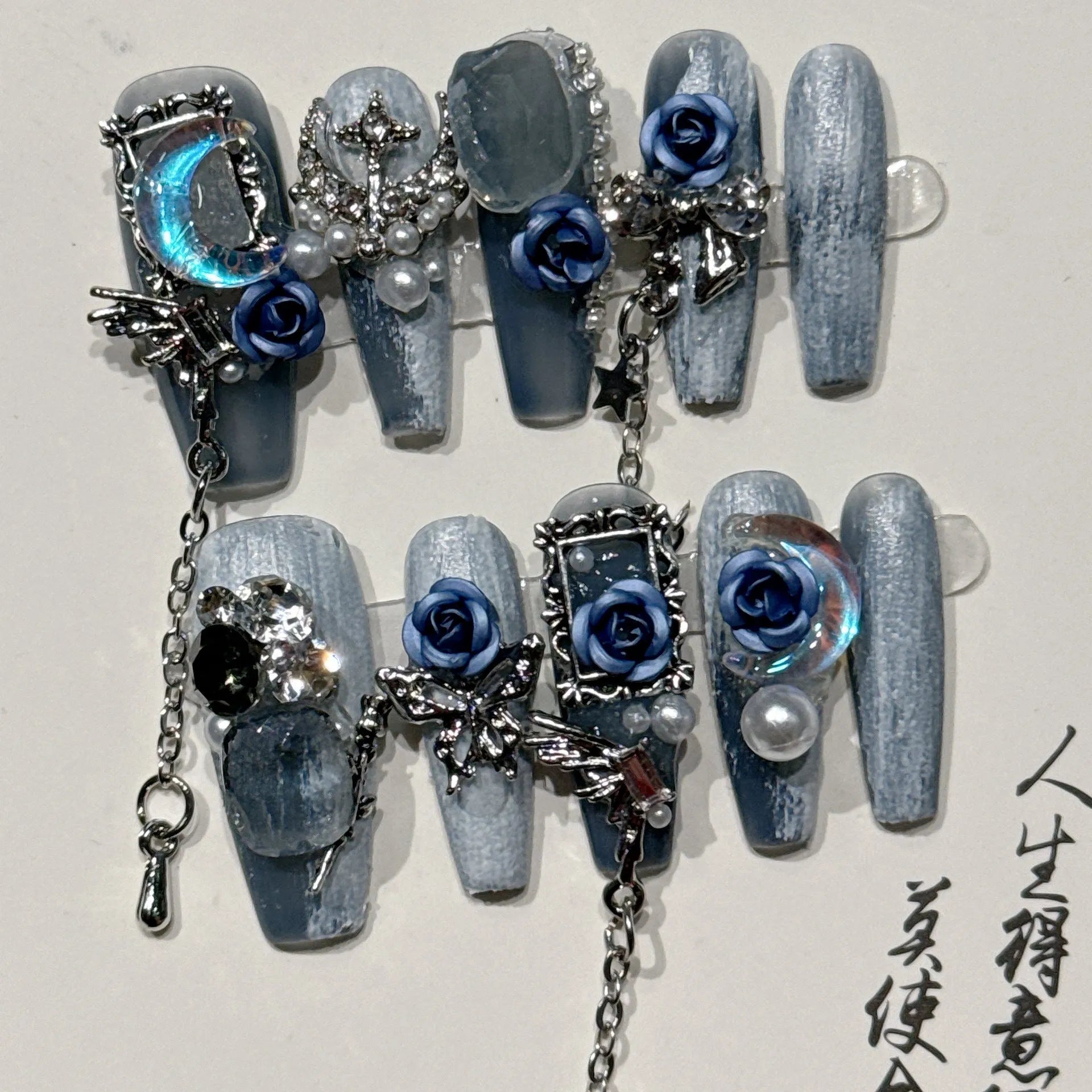 Heavy industry night blue manicure set with ornate rose design and plastic storage case.