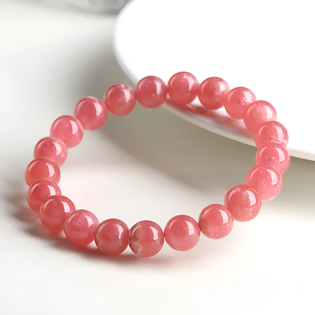 Women's red rhodochrosite crystal bracelet with geometric design and longevity lock fastening