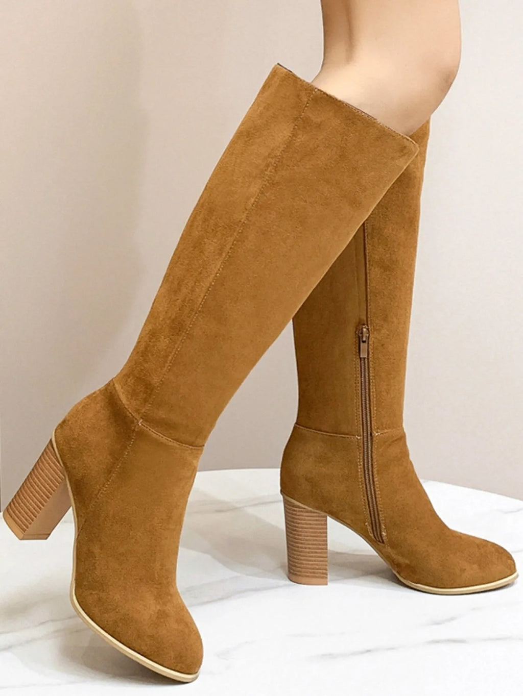 Women's black square toe high heel fashion boot made of synthetic PU.