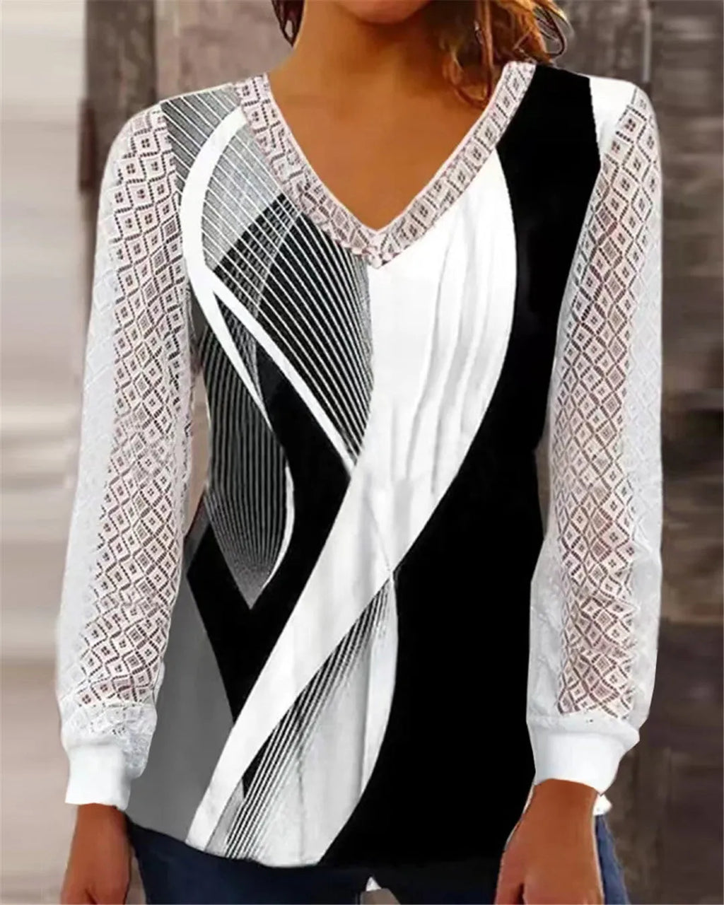 Purple loose V-neck top with hollow-out lace print and long sleeves