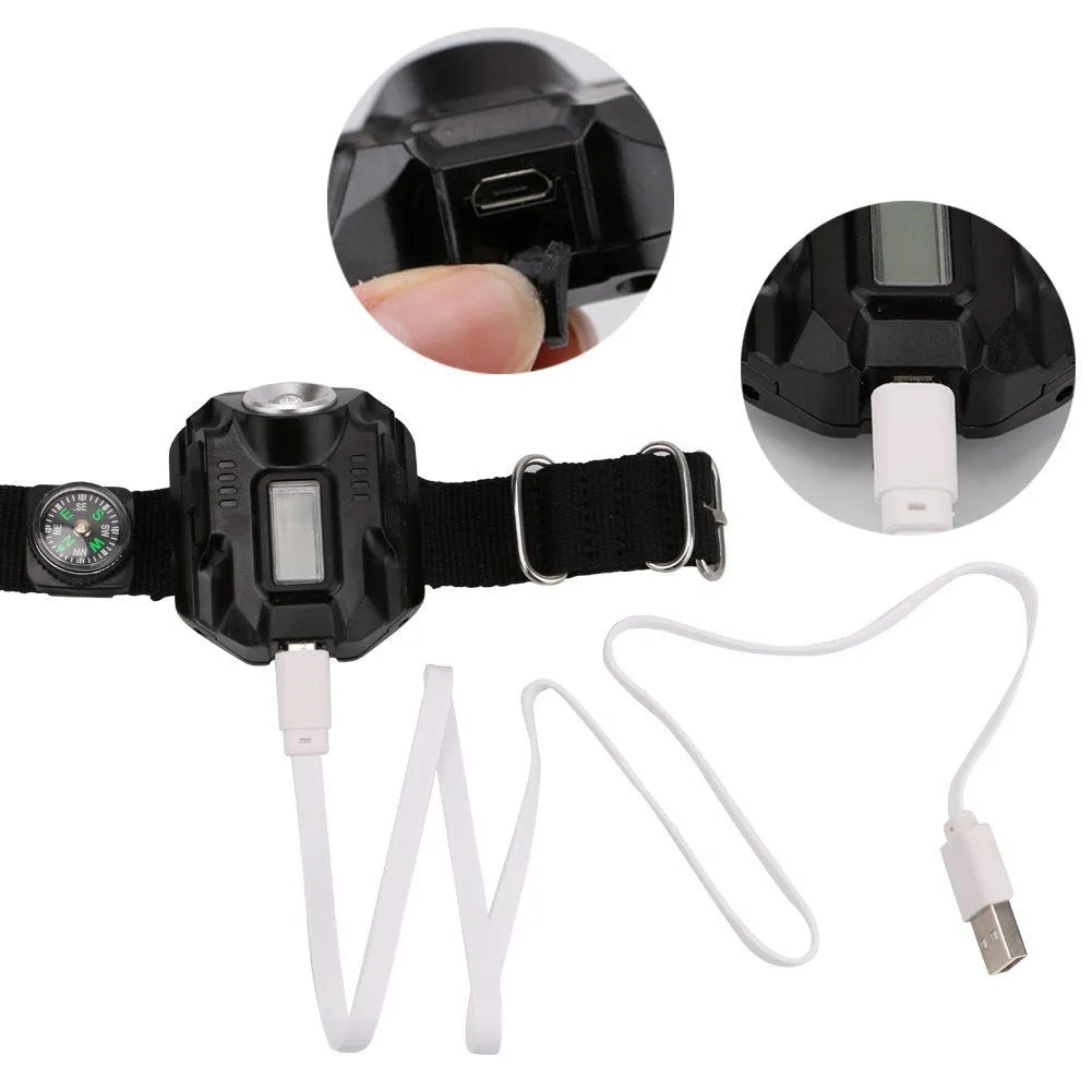 Black LED watch flashlight on wristband with compass and time display
