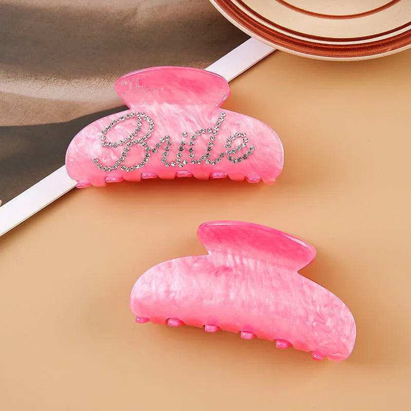 Acrylic hair barrette with sparkling diamond spot drills and English letters in pink or white.
