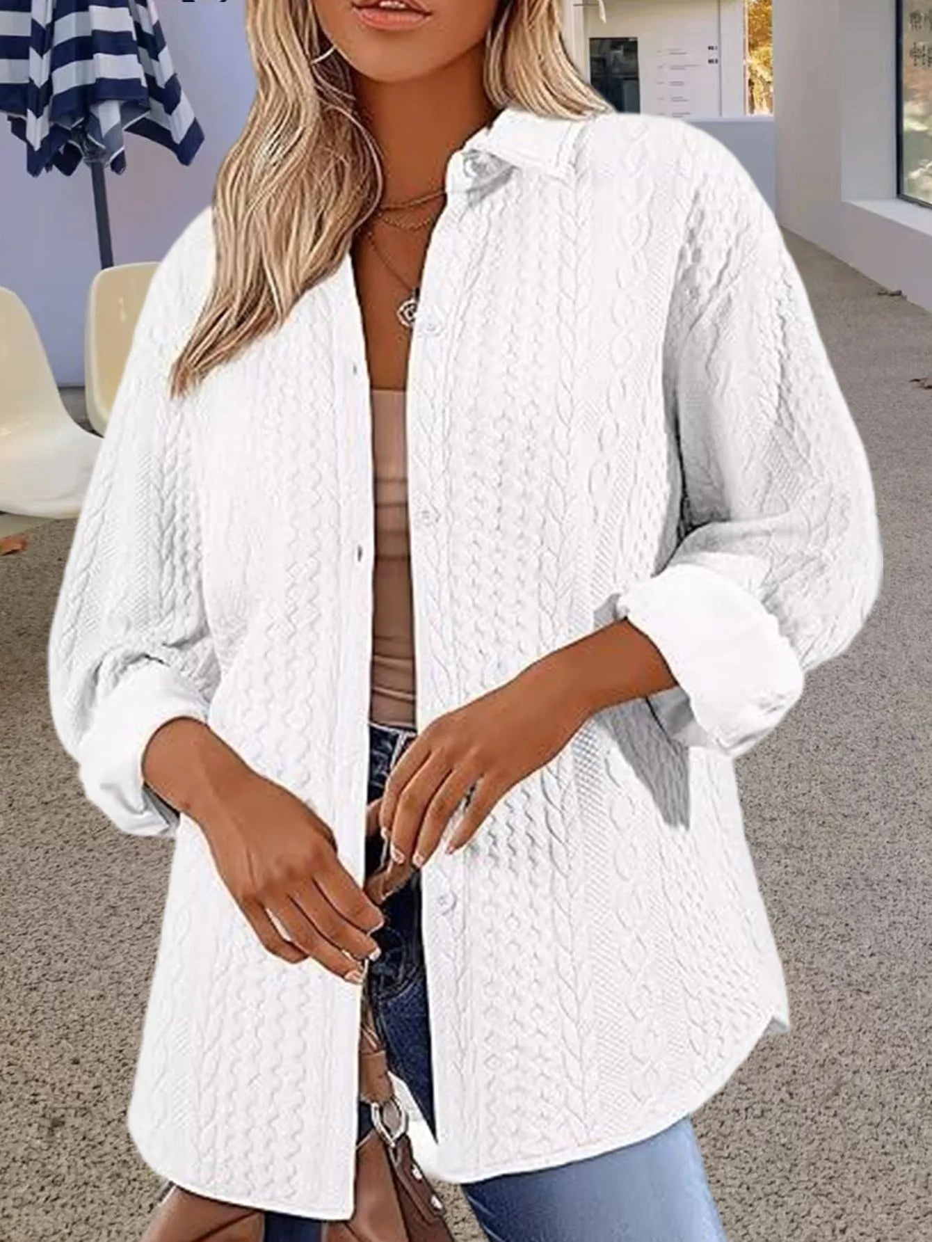 Women's solid colour long-sleeved knitted cardigan in black, shown in a cardigan style with contrast trim detail.