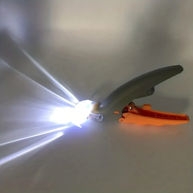 Yellow LED pet nail trimmer with magnifying glass for cats and dogs on a white background.