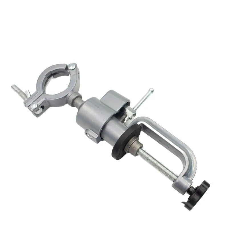 360 rotating clamp-on bench vise with tungsten steel jaws shown mounted to workbench edge