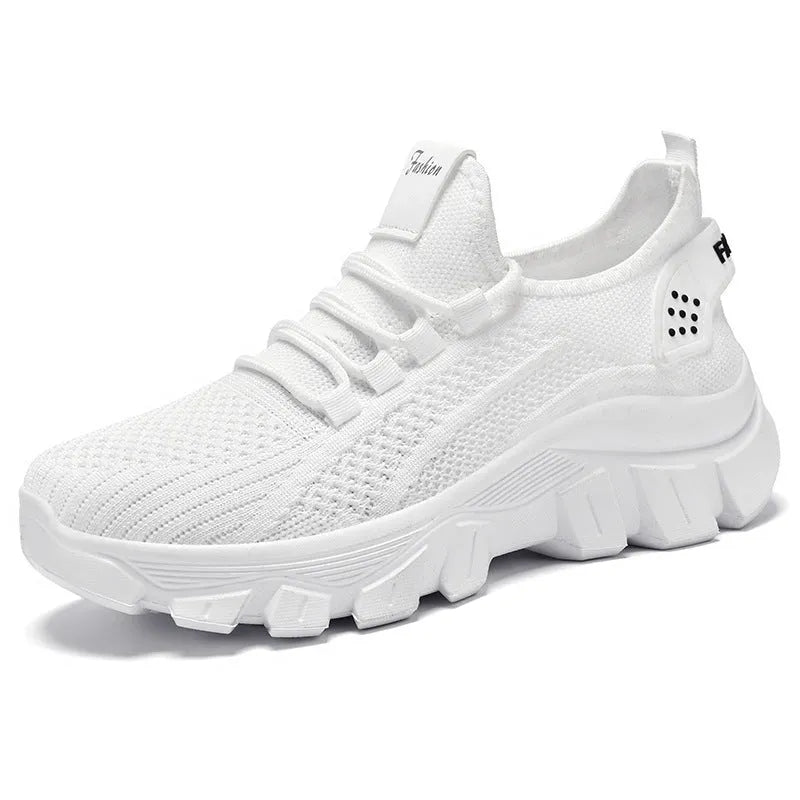 Women's white Flyknit sneakers with a thick PVC sole and front lace-up on a plain background.