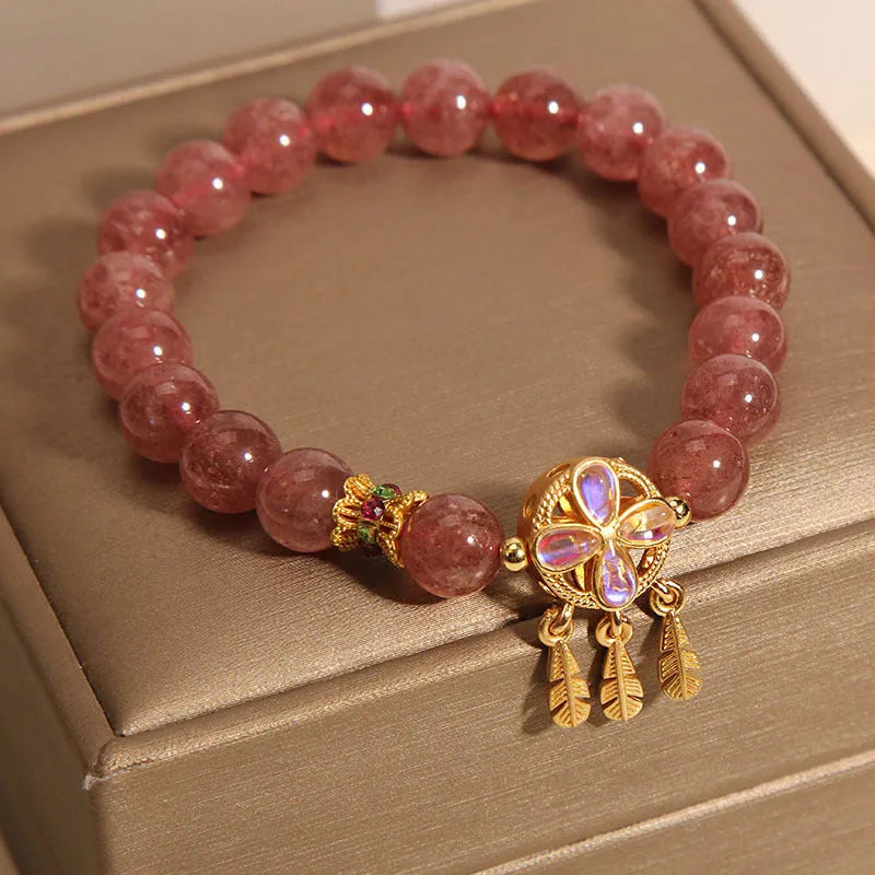 Women's strawberry quartz bracelet with four leaf dream catcher ball pendant