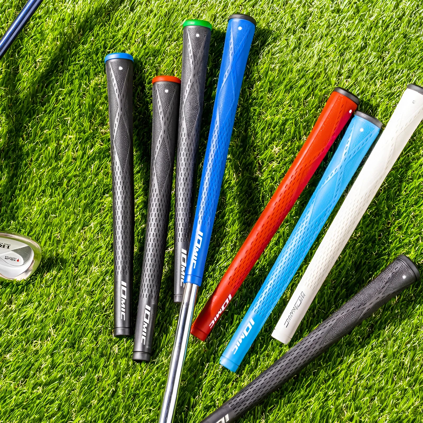 TPE golf club replacement grip shown in assorted colours including pink, red, blue, white, and black with coloured heads.