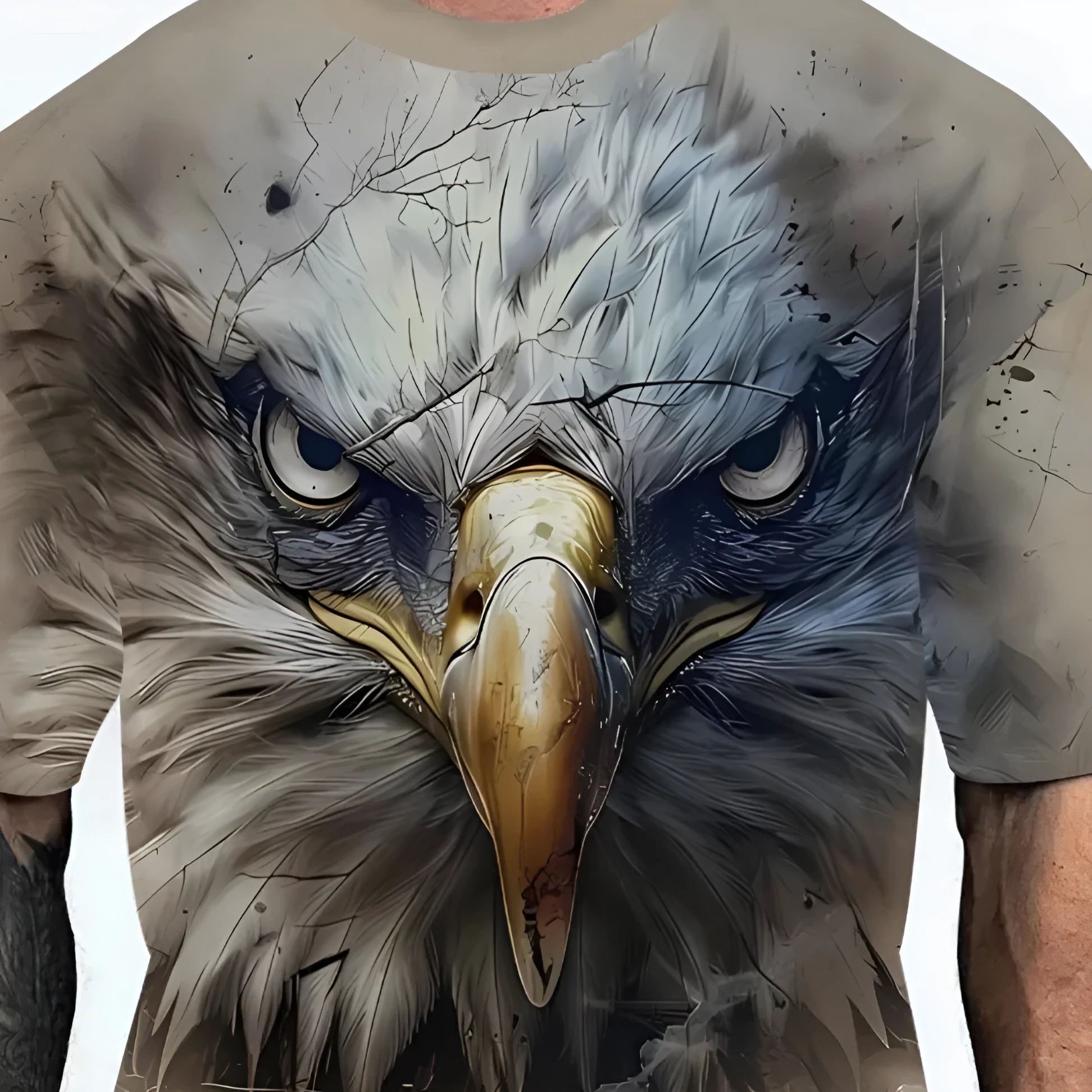 Man wearing a loose fit casual t-shirt featuring an eagle head graphic design on the front.