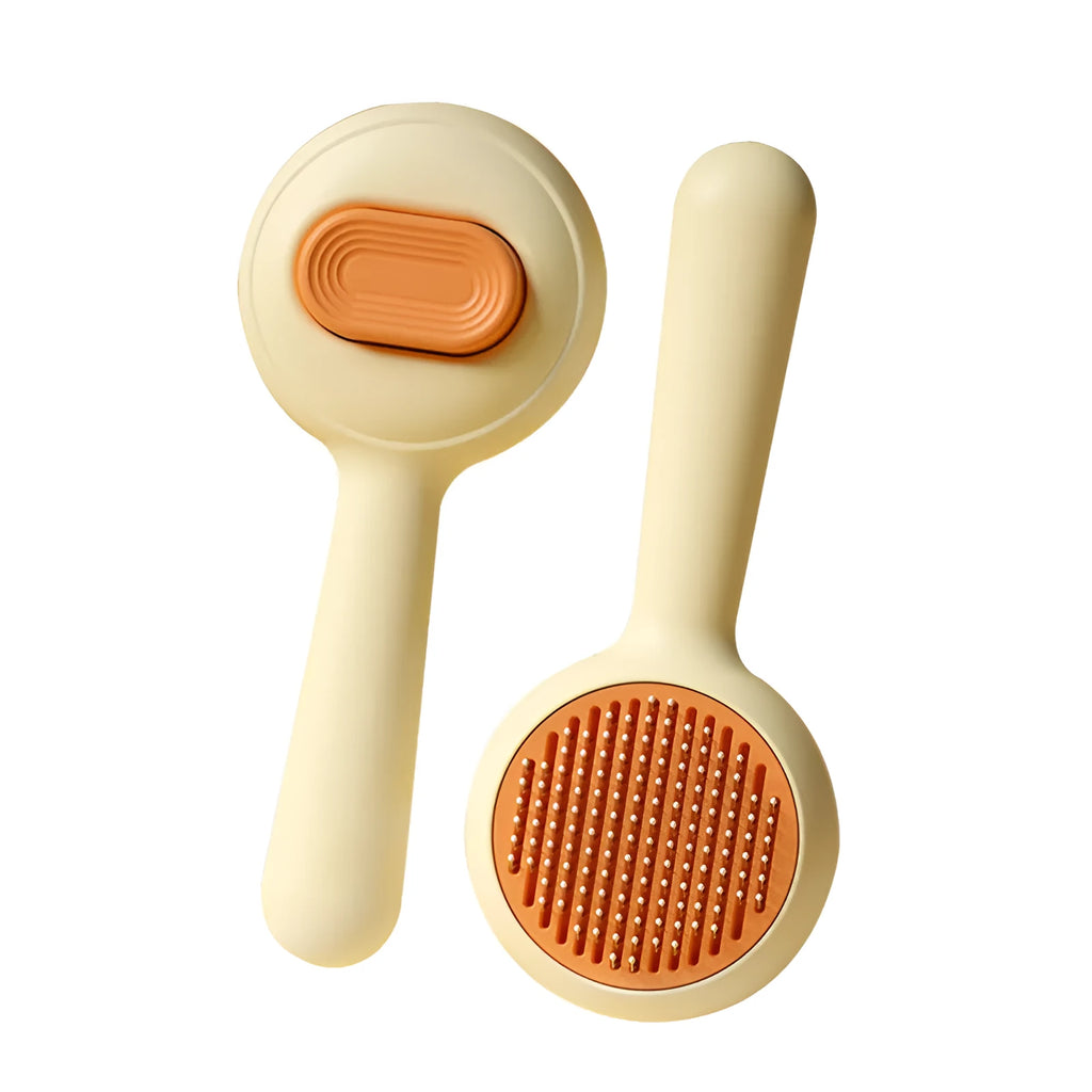 Green and yellow cat grooming brush with stainless steel comb teeth and a non-slip handle.