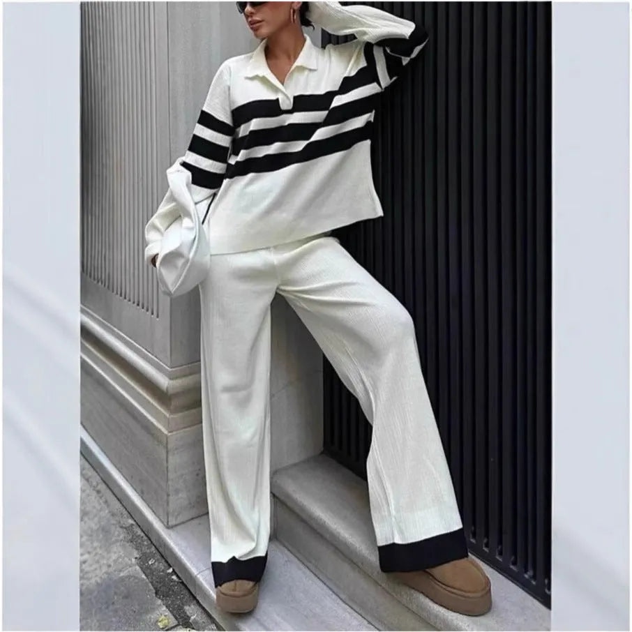 Women's black and white striped knitted two-piece set with polo collar and matching trousers