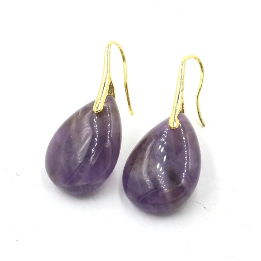 Geometric crystal water drop earrings in amethyst colour with electroplated metal setting.