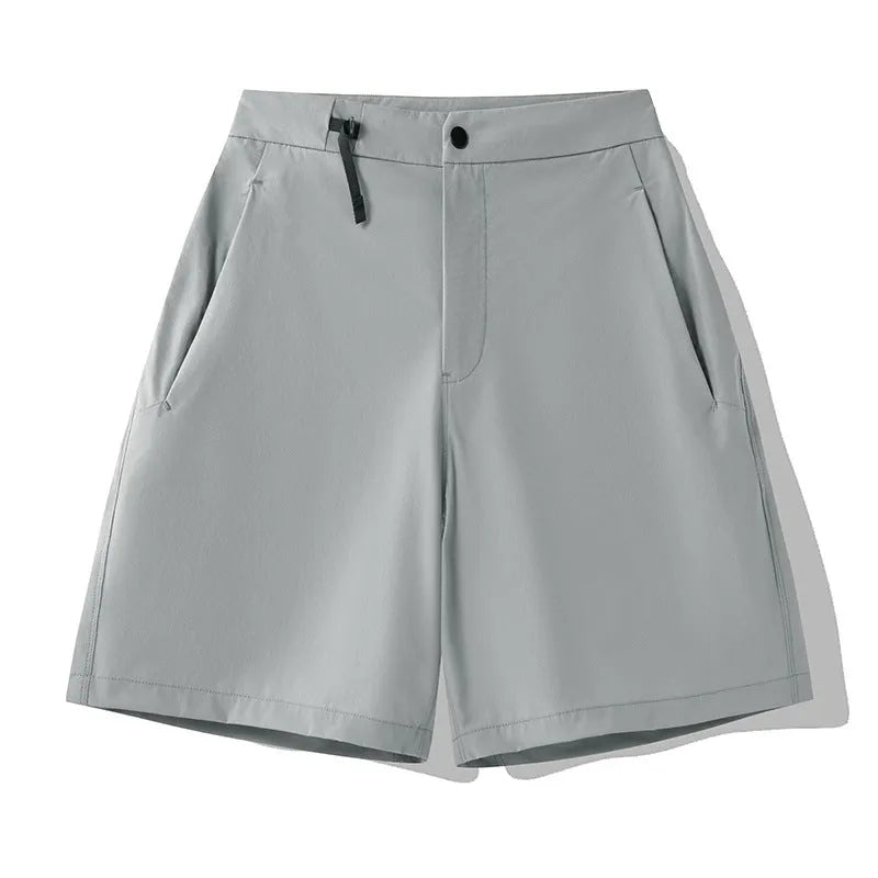 Men's quick-drying sports shorts in Army Green colour on a grey background.