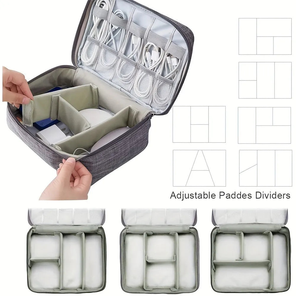 Black and grey waterproof electronics organiser bag open to show removable dividers and mesh pockets for cables.