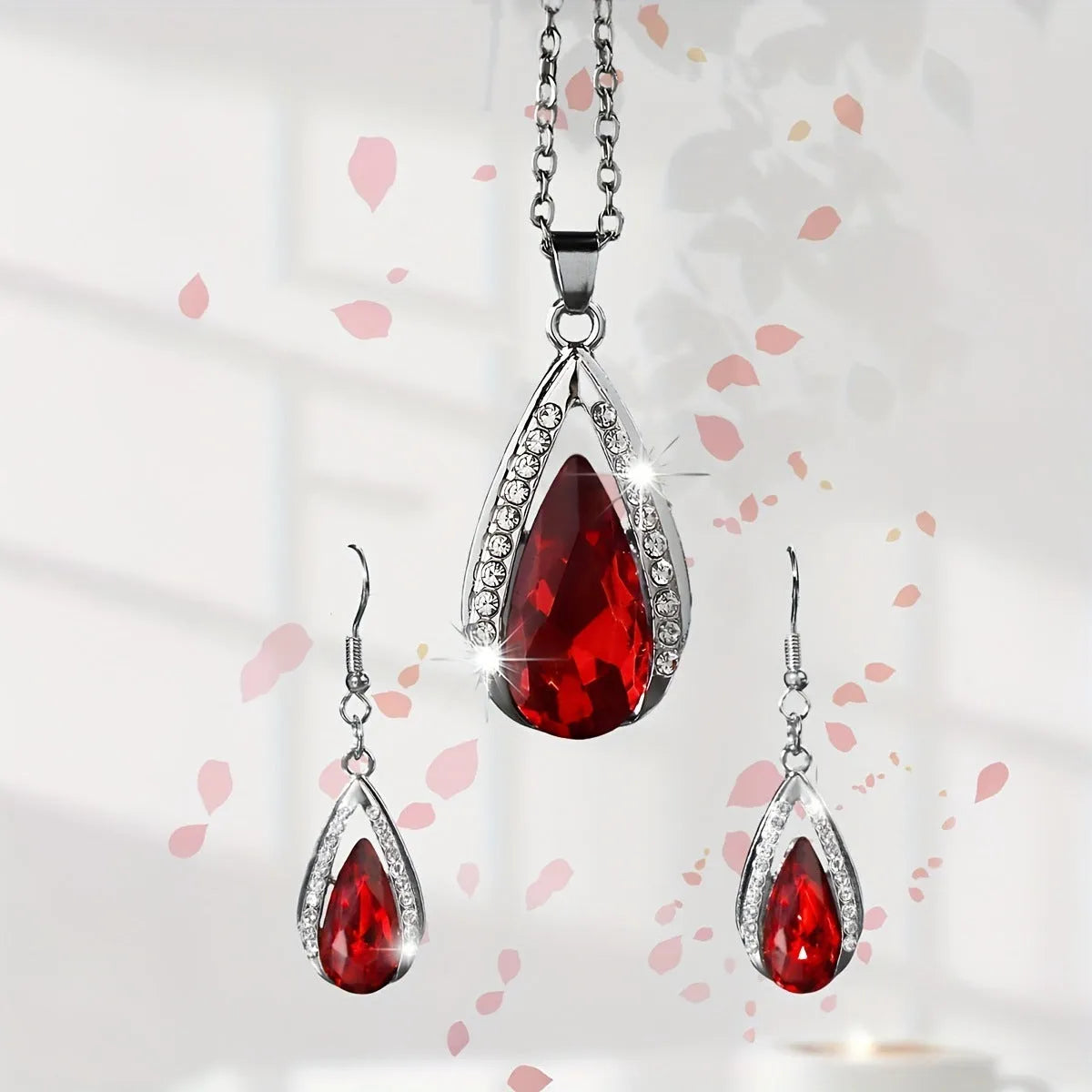 Teardrop glass pendant necklace and earrings matching suite in black or red alloy jewellery