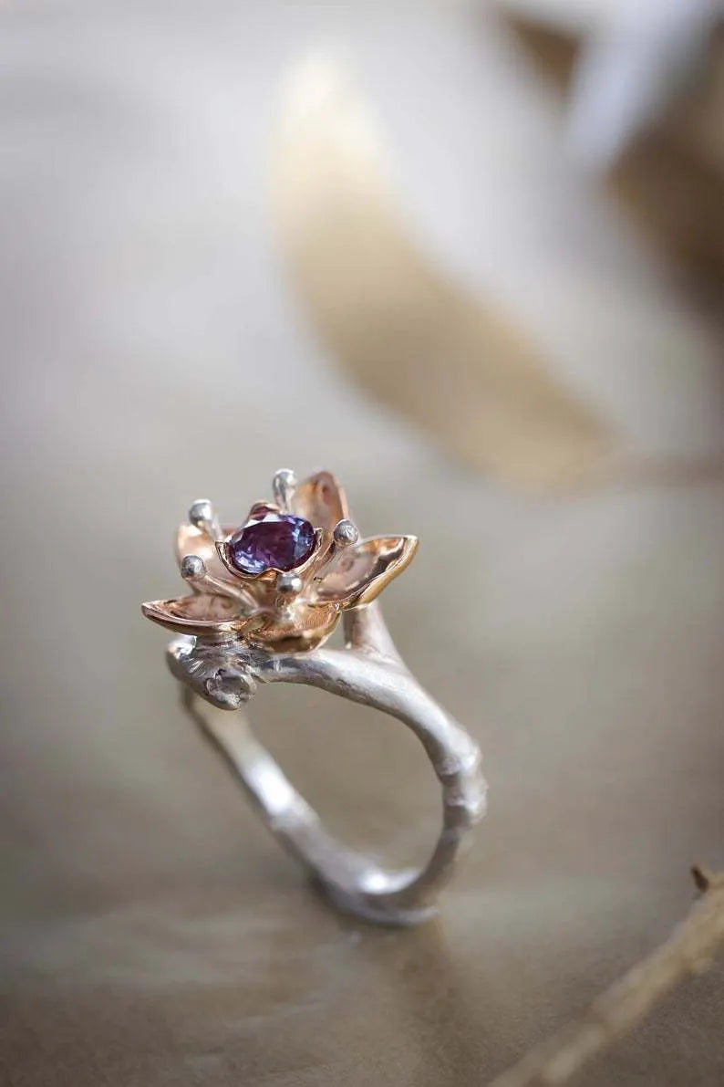 Silver two-tone floral geometric women's ring showing alloy construction and contemporary design