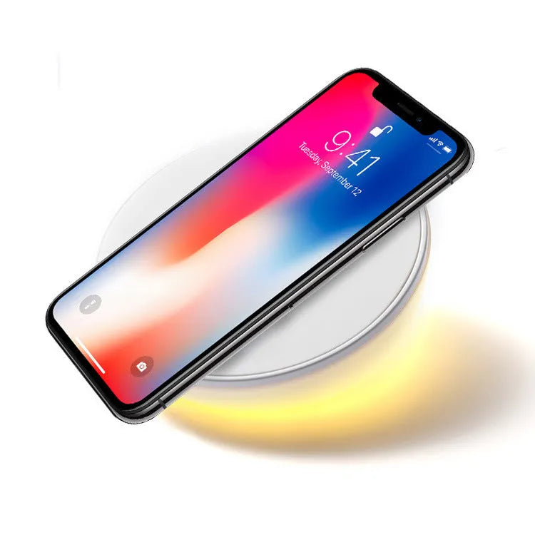 White wireless phone charger with LED clock display showing time, 115mm wide with three control buttons