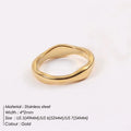 Women's stainless steel ring with wavy geometric design, 18K gold plated, in golden colour, on finger