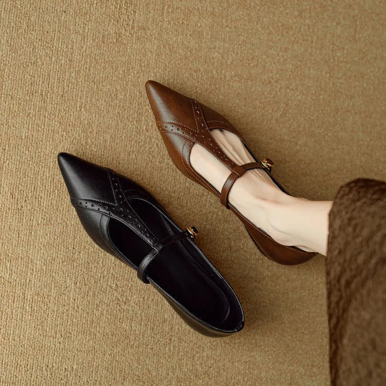 Brown women's low-cut cowhide leather flat shoes with a round toe and soft sole on a white background.