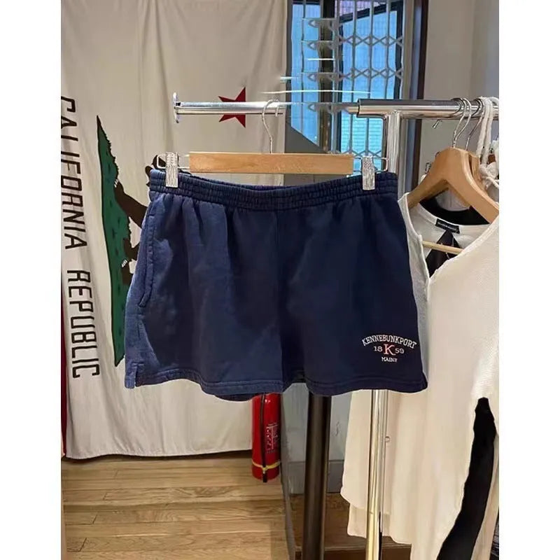Women's dark blue cotton hot pants shorts with white flag embroidery detail