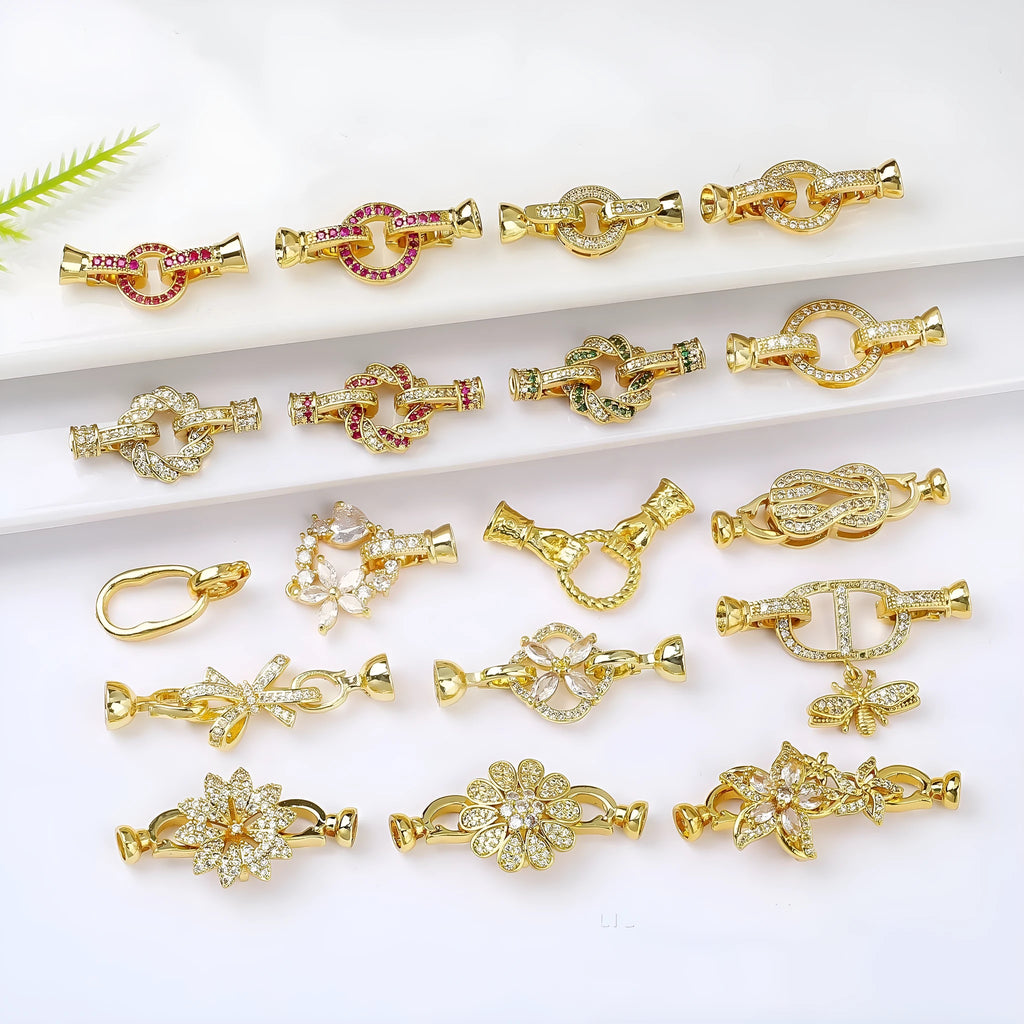 Small gold colour metal chain buckle for DIY necklace making on a white background.