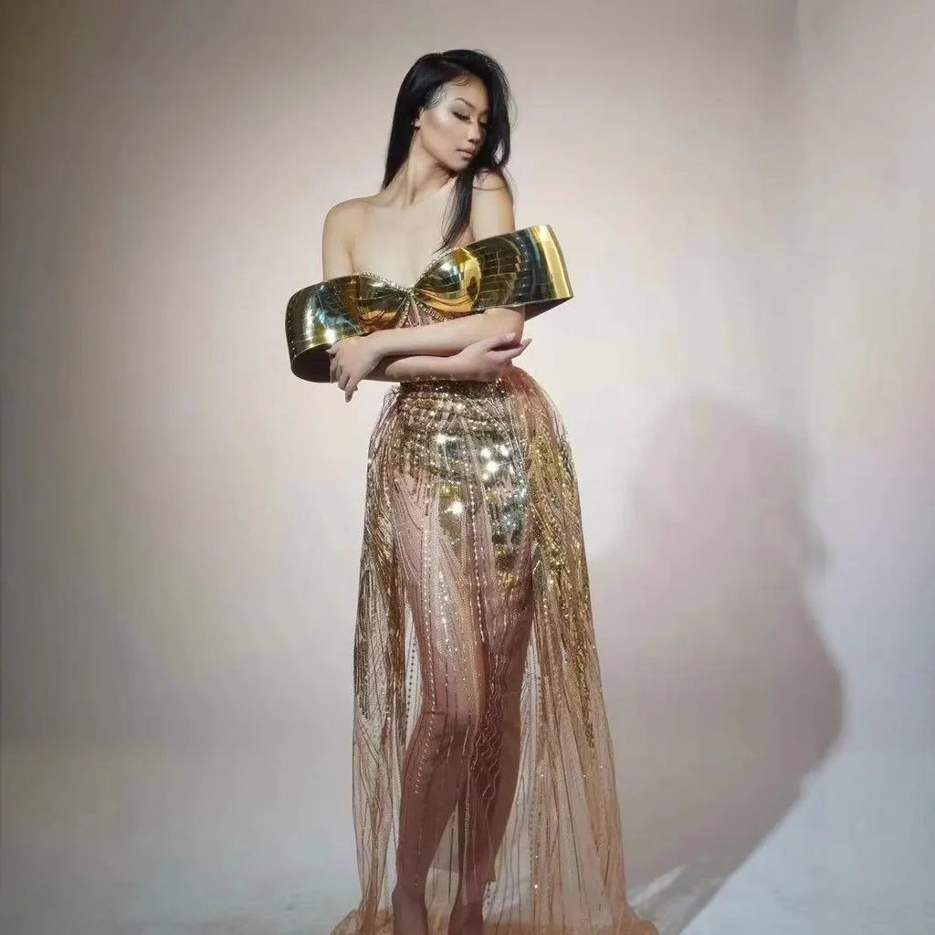 Gold sequined strapless dress with tulle skirt and thigh-high split, shown on mannequin