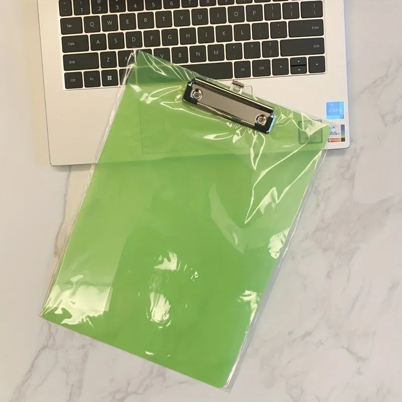 Transparent A4 plastic writing board pad with a silver metal clip, shown in blue colour.