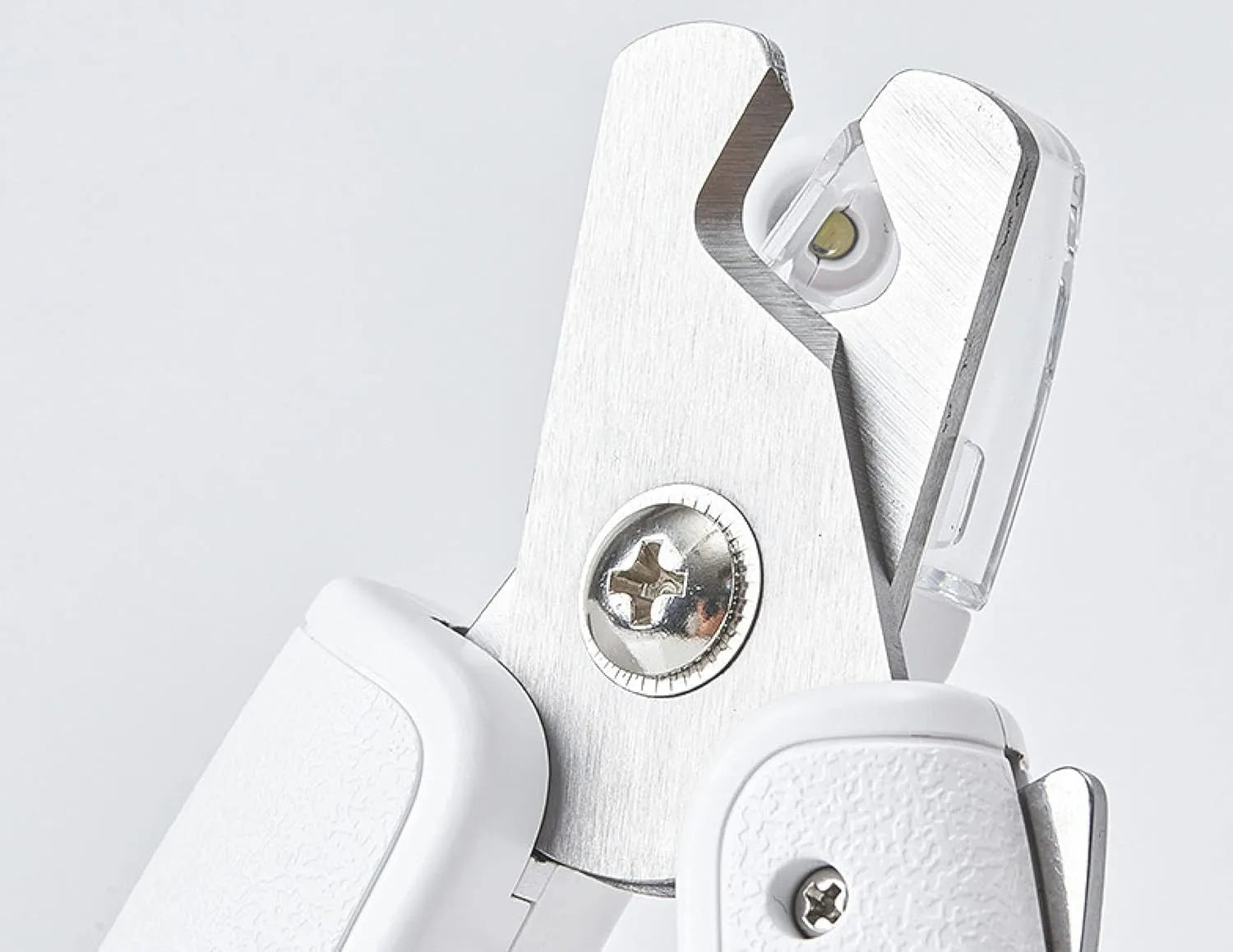 White pet nail clippers with LED light, transparent splash guard, and anti-slip handle.