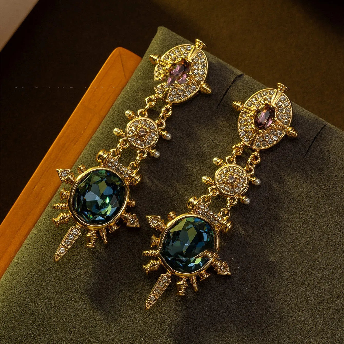 A pair of gold colour geometric round stud earrings with a retro court style design.