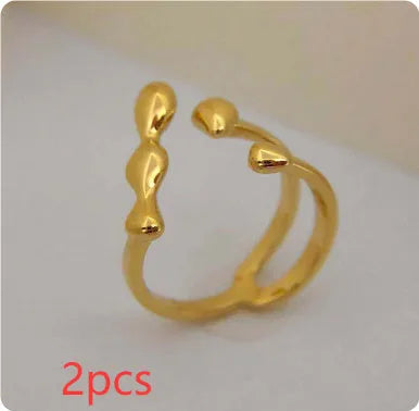 Adjustable brass opening ring with circular sphere element in gold or silver finish
